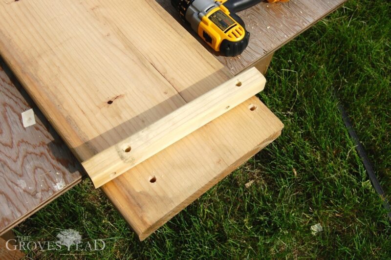 Holes drilled through stakes and boards
