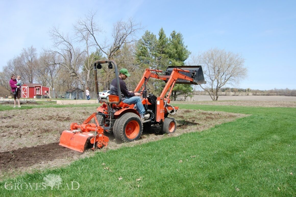 Tilling garden with tractor