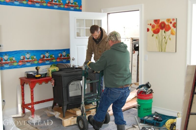 Carrying wood stove through front entryway