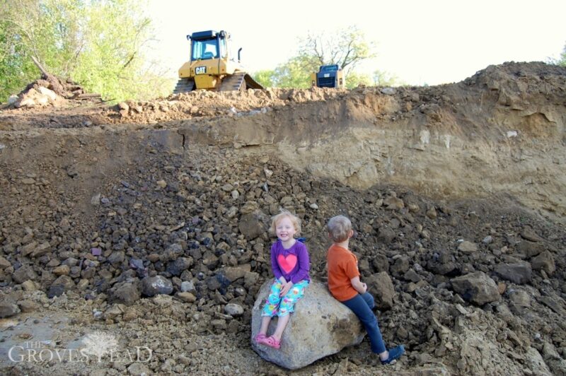 Kids playing in excavated trench