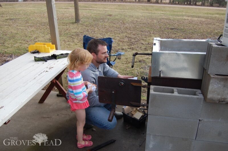 Elsie helping daddy get the evaporator started