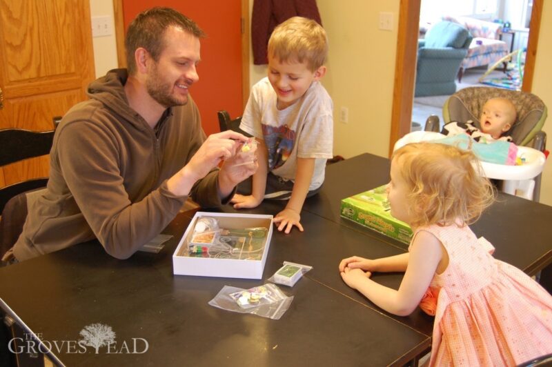 Dad shows pieces from the game Sugar Maple