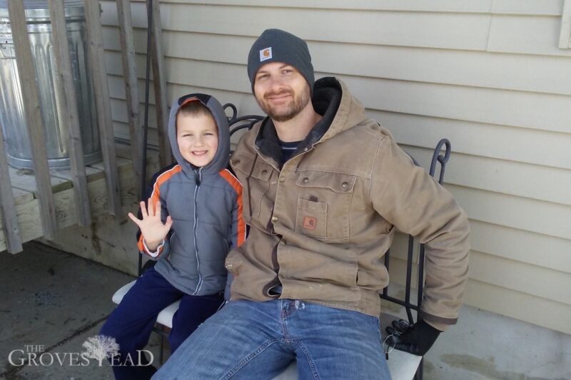 Dad and son evaporating maple syrup